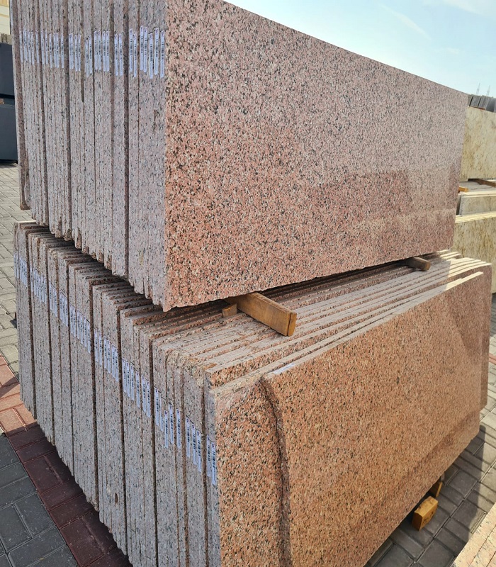 A slab of pink-and-silver Colorado mountain granite with characteristic feldspar crystals.