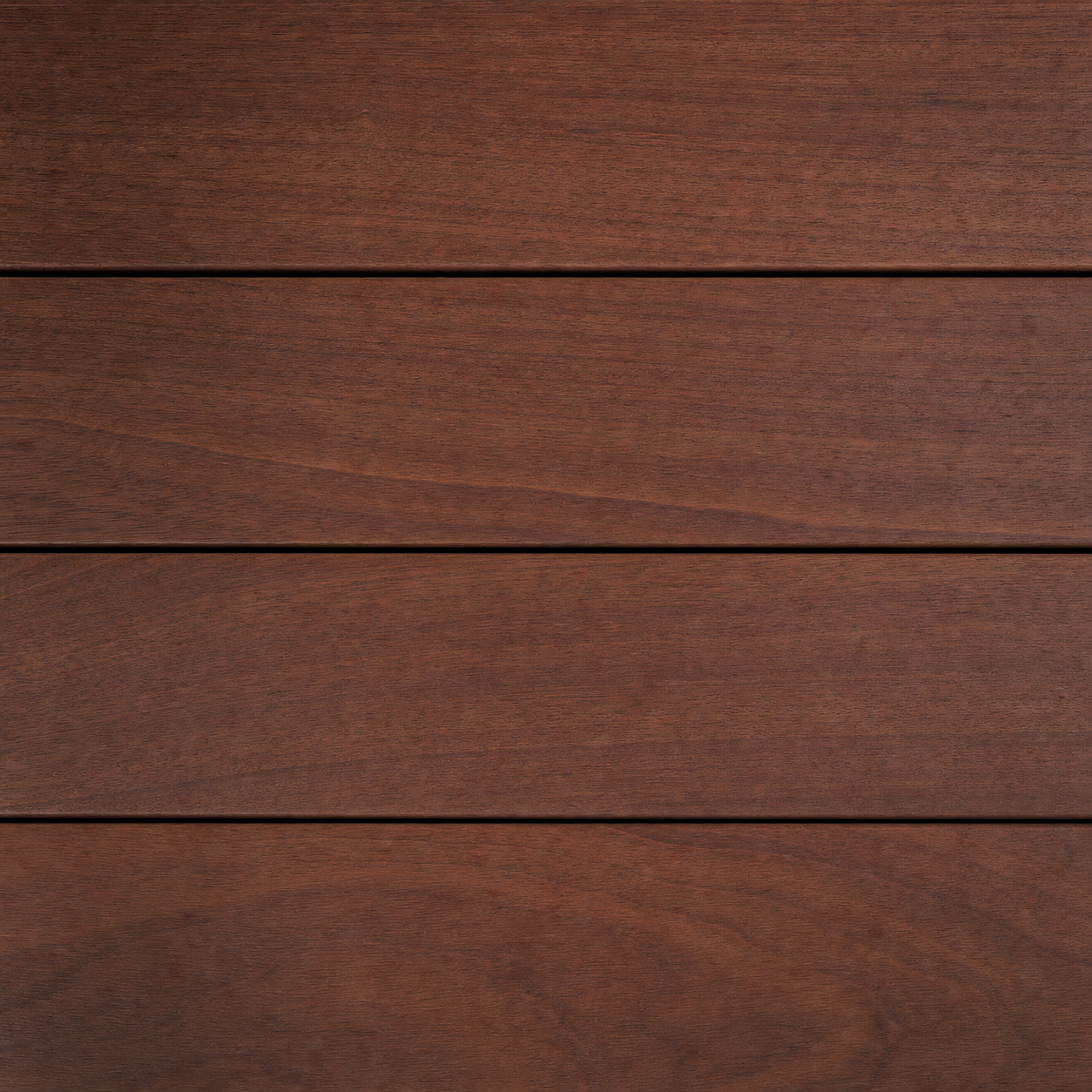 A Brazilian ipe decking plank in deep red-brown with a custom oil finish, dense and naturally salt-air resistant.
