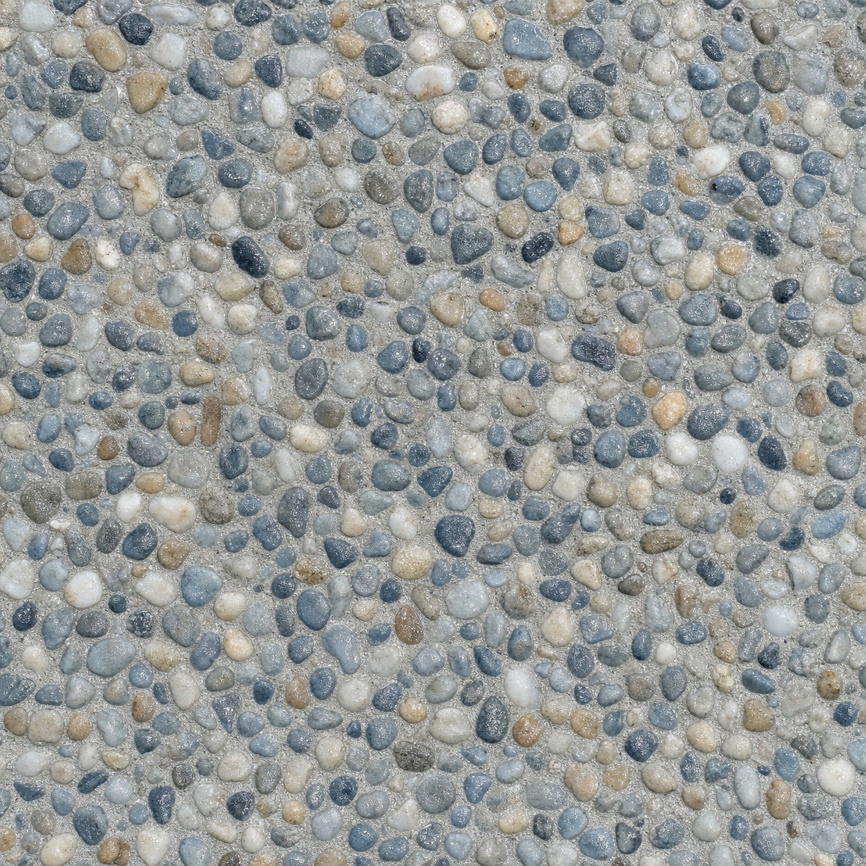 A premium pebble pool finish in a custom blend of blues, whites and warm sand.